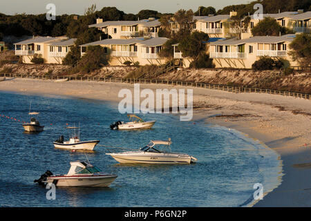 Anchored pleasure boats and holiday units at Longreach Bay on Rottnest Island, Western Australia Stock Photo