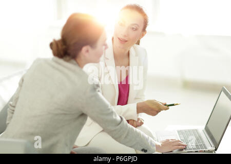 two women designers working on laptop Stock Photo