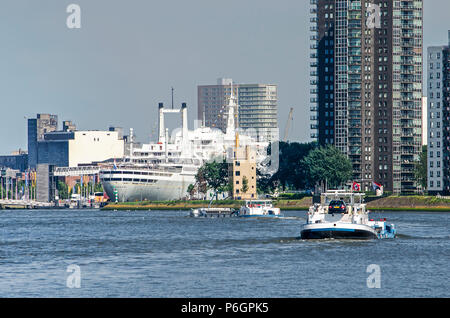 Rotterdam, The Netherlands, May 31, 2018: Long distance view of former cruiseship SS Rotterdam, now a hotel and moored at the neighbourhood of Katendr Stock Photo