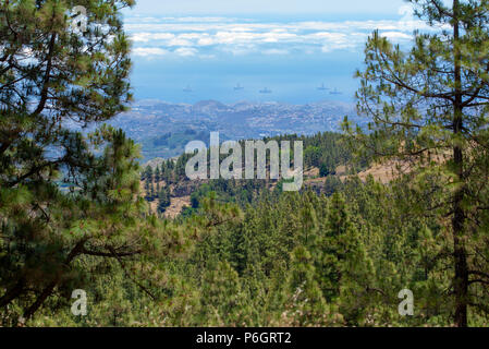 Gran Canaria, view from Las Cumbres towards ocean, oil rigs moving to service areas of the port in far distance Stock Photo