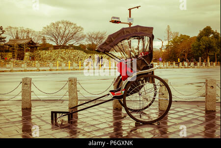 Kyoto, Japan - Nov 29, 2016. A rickshaw on street at old town in Kyoto Japan. Kyoto was the capital of Japan for over a millennium. Stock Photo