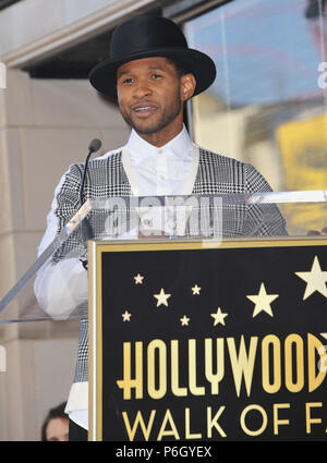 Usher at the star for Kenny Babyface Edmonds  on the Hollywood Walk Of Fame in Los Angeles.Usher 122  Event in Hollywood Life - California, Red Carpet Event, USA, Film Industry, Celebrities, Photography, Bestof, Arts Culture and Entertainment, Topix Celebrities fashion, Best of, Hollywood Life, Event in Hollywood Life - California, movie celebrities, TV celebrities, Music celebrities, Topix, Bestof, Arts Culture and Entertainment, Photography,    inquiry tsuni@Gamma-USA.com , Credit Tsuni / USA, Honored with a Star on the Hollywood Walk ofFame in Los Angeles,  2013 Stock Photo