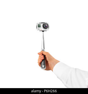 Hand holding action camera isolated, take selfie. Monopod hold in arm. Active cam, making self portrait. Selfi stick holder. Stock Photo