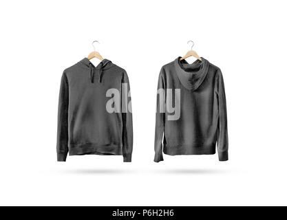 Blank black sweatshirt mockup set hanging on wooden hanger, front and back side view. Empty grey sweat shirt mock up on rack. Clear cotton hoody template. Plain textile hoodie. Loose overall jumper. Stock Photo