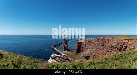 Lange Anna sea stack rock on Heligoland island against blue sea and clear sky Stock Photo