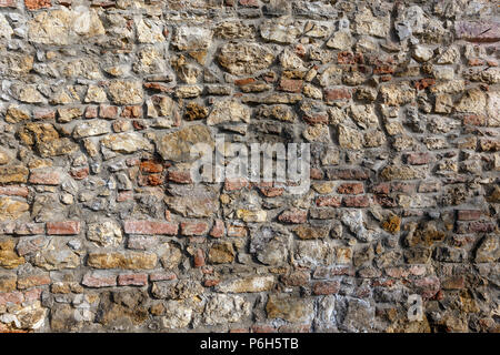 Medieval fortress antique brick and stone wall detail Stock Photo
