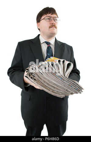 man holding a stack of newspapers isolated on a white background Stock Photo