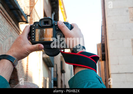 Man photographing a Holy Week procession. Madrid, Spain. Stock Photo