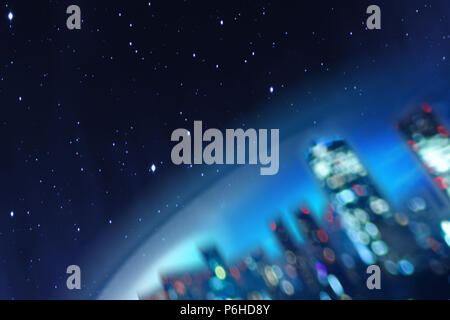 Conceptual illustration of a part of the Earth with a city of the future against the background of the cosmos or the universe with stars. Stock Photo