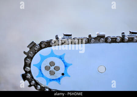 Detail of the chainsaw isolated on the white background Stock Photo