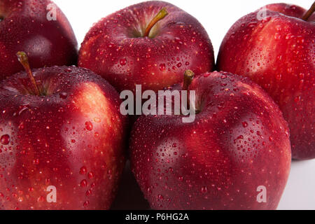 maroon apples closeup on a white background Stock Photo