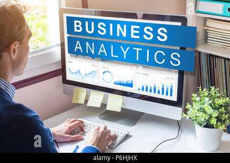 Business analytics and metrics for strategic decisions based on insights, data mining and modeling technology, analyst businessman working on computer Stock Photo
