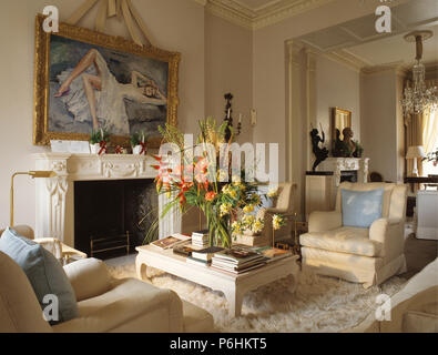 Large painting on wall above fireplace in nineties living room Stock Photo