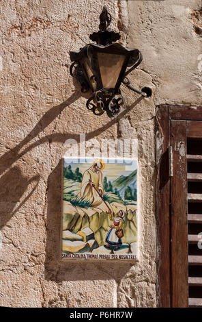 A tile plaque n in Valldemossa, Mallorca, in honour of the local saint, Santa Catalina Thomas who was born in the village. Stock Photo