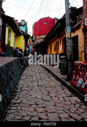 Street art and tourists in La Candelaria, Bogota, Colombia, the bohemian quarter. Stock Photo