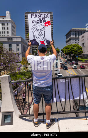 JUNE 30, 2018 - LOS ANGELES, CALIFORNIA, USA - 'Keep Families Together' Protest March with signs in Los Angeles, California Stock Photo