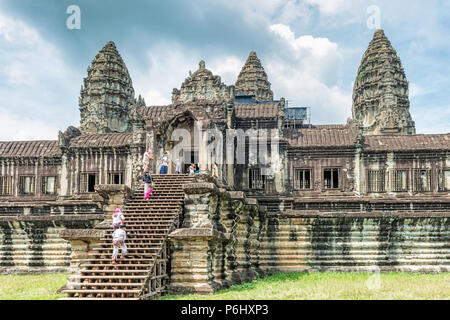 Angkor Wat, Cambodia - November 17, 2017: Tourists visiting galleriesof Angkor Wat temple. It is the largest religious complex in the world and was bu Stock Photo
