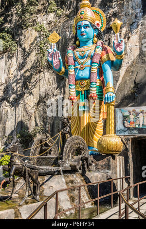 Batu Caves in Kuala Lumpur Malaysia with their  spectacular towering statues of Hanuman, Murugan and Krishna Stock Photo