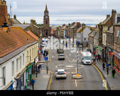 View looking south down Marygate the main shopping street in Berwick on Tweed towards the Town Hall and Clock tower Stock Photo