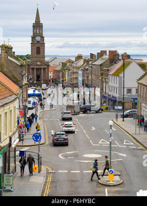 View looking south down Marygate the main shopping street in Berwick on Tweed towards the Town Hall and Clock tower Stock Photo