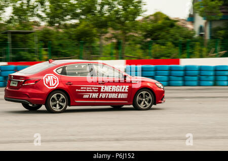 An eMG 6 from Chinese car manufacturer SAIC manoeuvring on a slalom course at the Tianma Race Circuit in Shanghai. Stock Photo