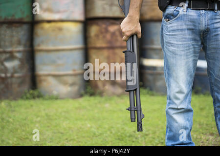 View of a man with a shotgun. Stock Photo