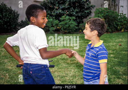 two boys shake hands MR   © Myrleen Pearsonblack Stock Photo