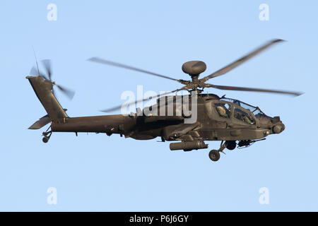 Army Air Corps Apache AH1 attack helicopter on the approach into it's home base of Wattisham, Suffolk. Stock Photo