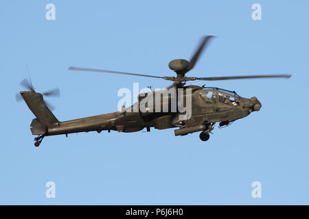 Army Air Corps Apache AH1 attack helicopter on the approach into it's home base of Wattisham, Suffolk. Stock Photo