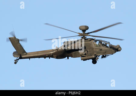 Army Air Corps Apache AH1 attack helicopter on the approach into it's home base of Wattisham, Suffolk. Stock Photo