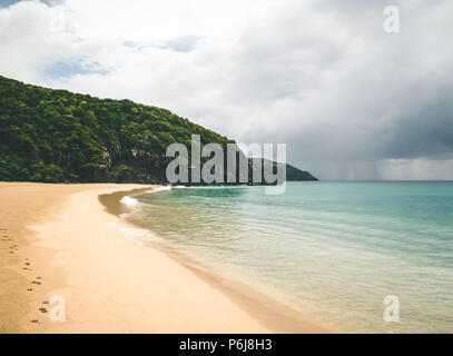 Distant rain shower from beach. Stock Photo