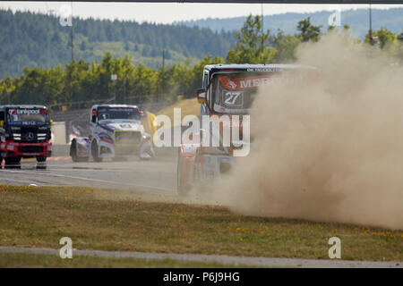 Nuerburg, Germany. 30th June, 2018. The racing trucks of the FIA European Truck Racing Championship start in the race at the ADAC Truck Grand Prix at the Nuerburgring. Gerhard Koerber of Germany throws up dust. Credit: Thomas Frey/dpa/Alamy Live News Stock Photo