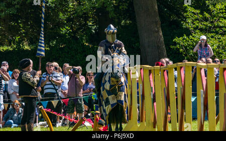 Jousting and Medieval Fair at Linlithgow Palace, Linlithgow, Scotland, United Kingdom, 30th June 2018. Historic Environment Scotland kick off their summer entertainment programme with a fabulous display of Medieval jousting in the grounds of the historic castle. The jousting is performed by Les Amis D'Onno equine stunt team. A knight prepares to joust Stock Photo