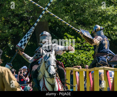 Jousting and Medieval Fair at Linlithgow Palace, Linlithgow, Scotland, United Kingdom, 30th June 2018. Historic Environment Scotland kick off their summer entertainment programme with a fabulous display of Medieval jousting in the grounds of the castle. The family fun day includes jousting performed by Les Amis D'Onno equine stunt team. Knights joust with lances Stock Photo