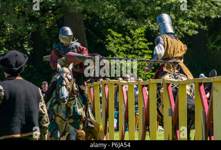 Jousting and Medieval Fair at Linlithgow Palace, Linlithgow, Scotland, United Kingdom, 30th June 2018. Historic Environment Scotland kick off their summer entertainment programme with a fabulous display of Medieval jousting in the grounds of the historic castle. The jousting is performed by Les Amis D'Onno equine stunt team. Knights joust with lancces Stock Photo