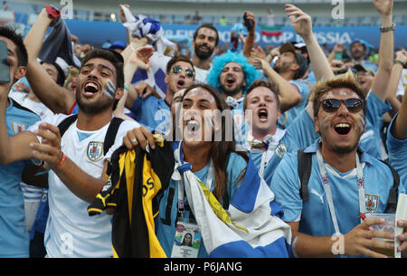 Sochi, Russia. 30th June, 2018. Fans of Uruguay cheer prior to the 2018 FIFA World Cup round of 16 match between Uruguay and Portugal in Sochi, Russia, June 30, 2018. Credit: Fei Maohua/Xinhua/Alamy Live News Stock Photo