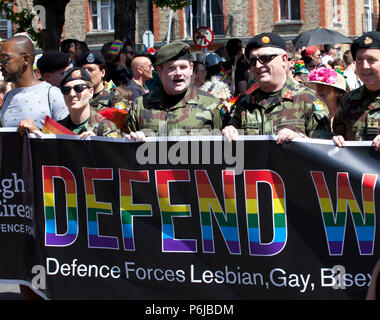 Members of the Defence Forces who are participating for the first time in uniform. take part in the annual LGBTI+ Dublin Pride Parade, the second biggest festival in Ireland after St Patrick's Day. Saturday 30th June 2018, St. Stephen’s Green, Dublin, Ireland Stock Photo