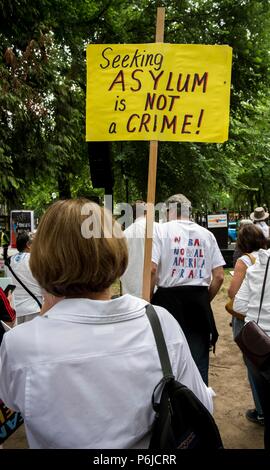 Portland, Oregon, USA. 30th June, 2018. People gather in downtown Portland to demonstrate against the Trump administration's ''zero tolerance'' policies of separating children from parents seeking asylum in the United States. Portland is one of hundreds of cities acoss the U.S. holding sister rallies to the mothership 'Families Belong Together' gathering in Washington, DC Credit: Brian Cahn/ZUMA Wire/Alamy Live News Stock Photo