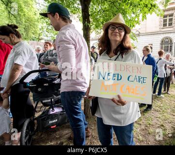 Portland, Oregon, USA. 30th June, 2018. People gather in downtown Portland to demonstrate against the Trump administration's ''zero tolerance'' policies of separating children from parents seeking asylum in the United States. Portland is one of hundreds of cities acoss the U.S. holding sister rallies to the mothership 'Families Belong Together' gathering in Washington, DC Credit: Brian Cahn/ZUMA Wire/Alamy Live News Stock Photo