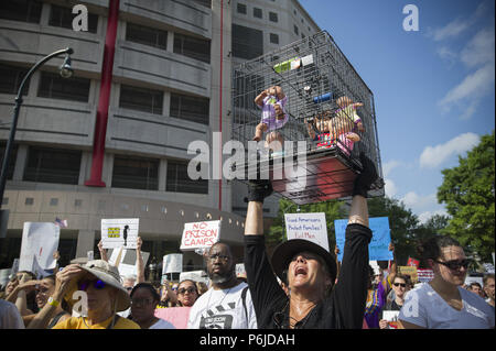 Atlanta, GA, USA. 30th June, 2018. Several thousand people gather outside Atlanta's city detention center to protest federal government's border policies Saturday, marching peacefully as part of a national effort to spotlight U.S. immigration policies that are separating children from their parents. The Families Belong Together event brought a large crowd together after a roughly half-mile procession that started at the Atlanta Detention Center and ended at the Richard B. Russell Federal Building Credit: Robin Rayne Nelson/ZUMA Wire/Alamy Live News Stock Photo