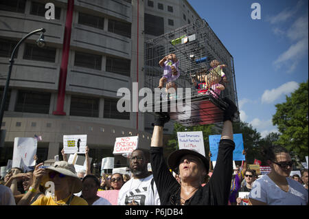 Atlanta, GA, USA. 30th June, 2018. Several thousand people gather outside Atlanta's city detention center to protest federal government's border policies Saturday, marching peacefully as part of a national effort to spotlight U.S. immigration policies that are separating children from their parents. The Families Belong Together event brought a large crowd together after a roughly half-mile procession that started at the Atlanta Detention Center and ended at the Richard B. Russell Federal Building Credit: Robin Rayne Nelson/ZUMA Wire/Alamy Live News Stock Photo