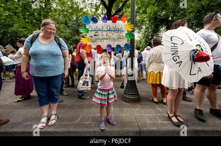 Portland, Oregon, USA. 30th June, 2018. People gather in downtown Portland to demonstrate against the Trump administration's ''zero tolerance'' policies of separating children from parents seeking asylum in the United States. Portland is one of hundreds of cities acoss the U.S. holding sister rallies to the mothership 'Families Belong Together' gathering in Washington, DC Credit: Brian Cahn/ZUMA Wire/Alamy Live News Stock Photo