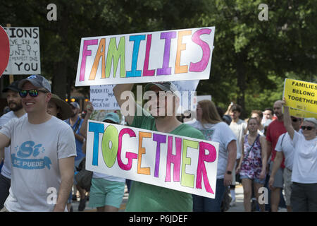 Atlanta, GA, USA. 30th June, 2018. Several thousand people gather outside Atlanta's city detention center to protest federal government's border policies Saturday, marching peacefully as part of a national effort to spotlight U.S. immigration policies that are separating children from their parents. The Families Belong Together event brought a large crowd together after a roughly half-mile procession that started at the Atlanta Detention Center and ended at the Richard B. Russell Federal Building Credit: Robin Rayne Nelson/ZUMA Wire/Alamy Live News Stock Photo