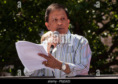 London, UK. 30th June 2018. Dr Chaand Nagpaul, Chair of the British Medical Association (BMA), addresses thousands of people, including many nurses, doctors and health workers, attending a rally and march to mark the 70th birthday of the National Health Service (NHS) and to demand an end to cuts to and privatisation of public services. The event was organised by the People's Assembly Against Austerity, Health Campaigns Together, the TUC and eleven other health trade unions. Credit: Mark Kerrison/Alamy Live News Stock Photo