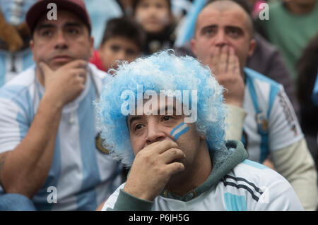 Buenos Aires, Argentina. 30th June, 2018. Argentina's fans react during the live broadcast on a giant screen of the 2018 FIFA World Cup round of 16 match between France and Argentina at San Martin square, Buenos Aires, Argentina, on June 30, 2018. Credit: Martin Zabala/Xinhua/Alamy Live News Stock Photo