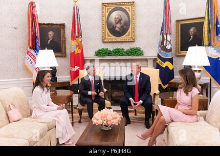 WASHINGTON, DC - WEEK OF JUNE 24: President Donald J. Trump and First Lady Melania Trump welcome King Abdullah II and Queen Rania of Jordan to the Oval Office of the White House  People:  President Donald Trump Stock Photo