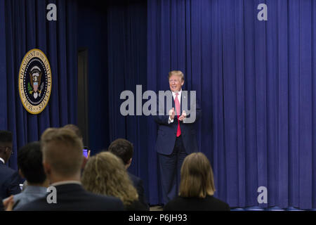 WASHINGTON, DC - WEEK OF JUNE 24: President Donald J. Trump applauds his audience as he arrives onstage on Wednesday, June 27, 2018, to deliver remarks at the Face-to-Face with Our Future event in the South Court Auditorium of the Eisenhower Executive Office Building at the White House.  People:  President Donald Trump Stock Photo
