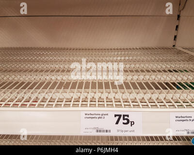 London, UK. 30 June, 2018. Shortage of manufactured Carbon Dioxide gas has resulted in certain gas packaged foods not entering the supermarket supply chain within the UK. Empty shelves in a London supermarket normally stocked with crumpets, gas packed for longer shelf life. The CO2 shortage is also affecting fizzy drinks manufacturing. Credit: Malcolm Park/Alamy Live News. Stock Photo