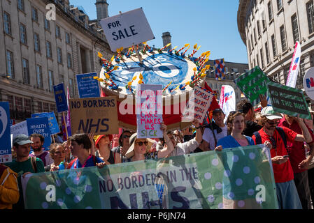 London, UK. 30th June 2018. NHS 70 march on Downing Street. Tens of thousands gathered by the BBC at Portland Place and marched through central London to mark the 70th anniversary of the National Health Service. They were campaigning for an end to cuts, privatisation, and for credible funding. The march and rally was organised by the People's Assembly Against Austerity, Health Campaigns Together, TUC and health service trade unions. Credit: Stephen Bell/Alamy Live News. Stock Photo