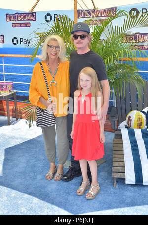 Westwood, Ca. 30th June, 2018. David Spade, Harper Spade and Judith J. Spade, arriving to Columbia Pictures And Sony Pictures Animation's World Premiere Of 'Hotel Transylvania 3: Summer Vacation' at Regency Village Theatre in Westwood, California on June 30, 2018. Credit: Faye Sadou/Media Punch/Alamy Live News Stock Photo